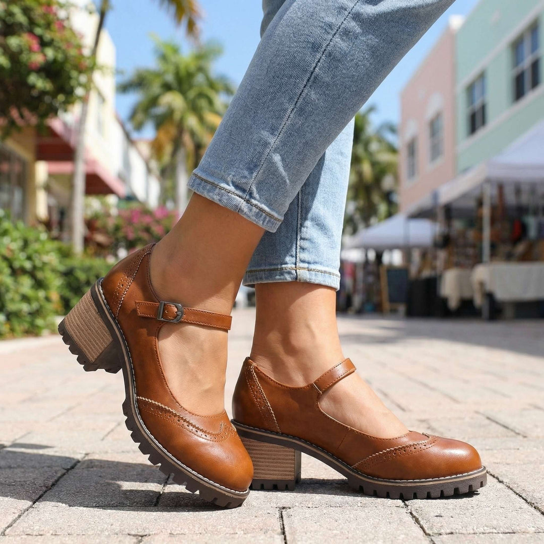 Retro style womens Mary Jane footwear featuring decorative brogue perforations