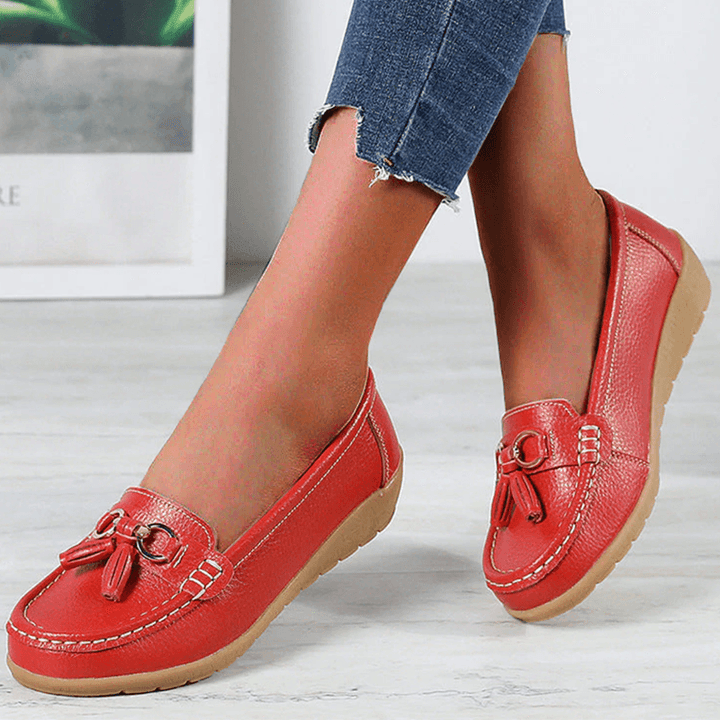 Close-up of decorative tassel detail on women's comfort flat loafers