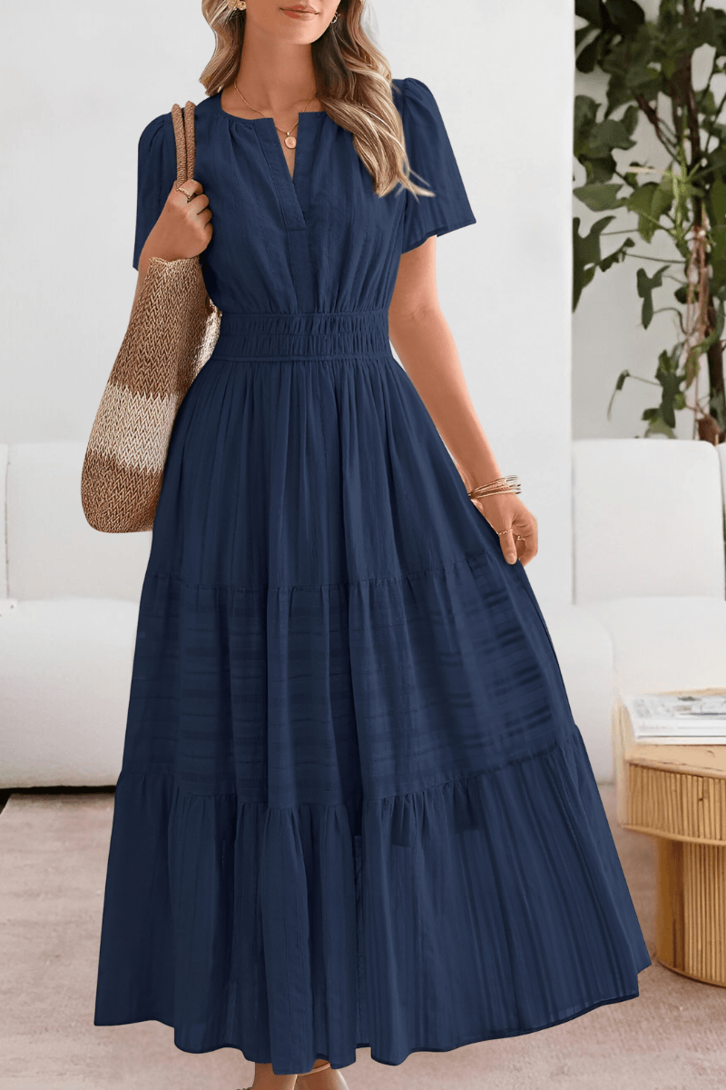 Plus size tiered maxi dress featuring short flutter sleeves