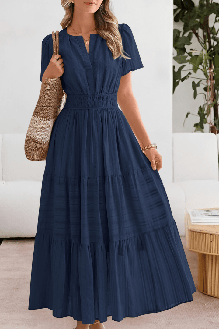 Plus size tiered maxi dress featuring short flutter sleeves