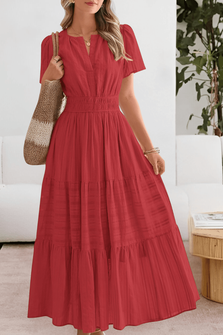 Flowy women's casual dress with tiered layers and flutter sleeves