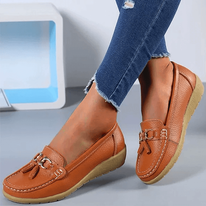 Back view of women's walking loafers highlighting supportive heel construction