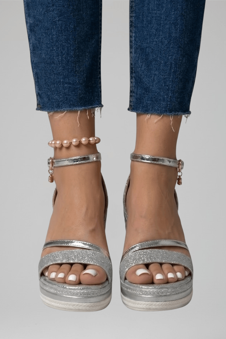 Close-up of outsole on wedge sandals displaying anti-slip tread and durable grip