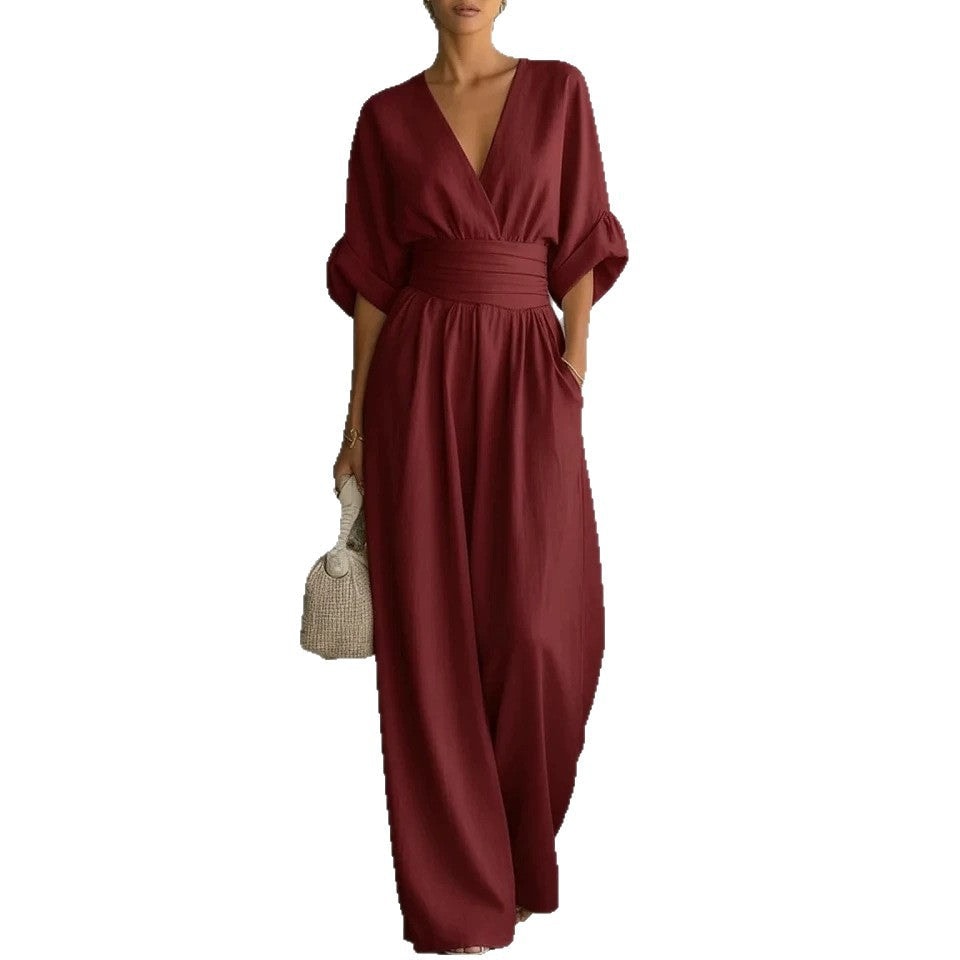 Close-up of wrap V-neckline and fabric texture on balloon sleeve jumpsuit