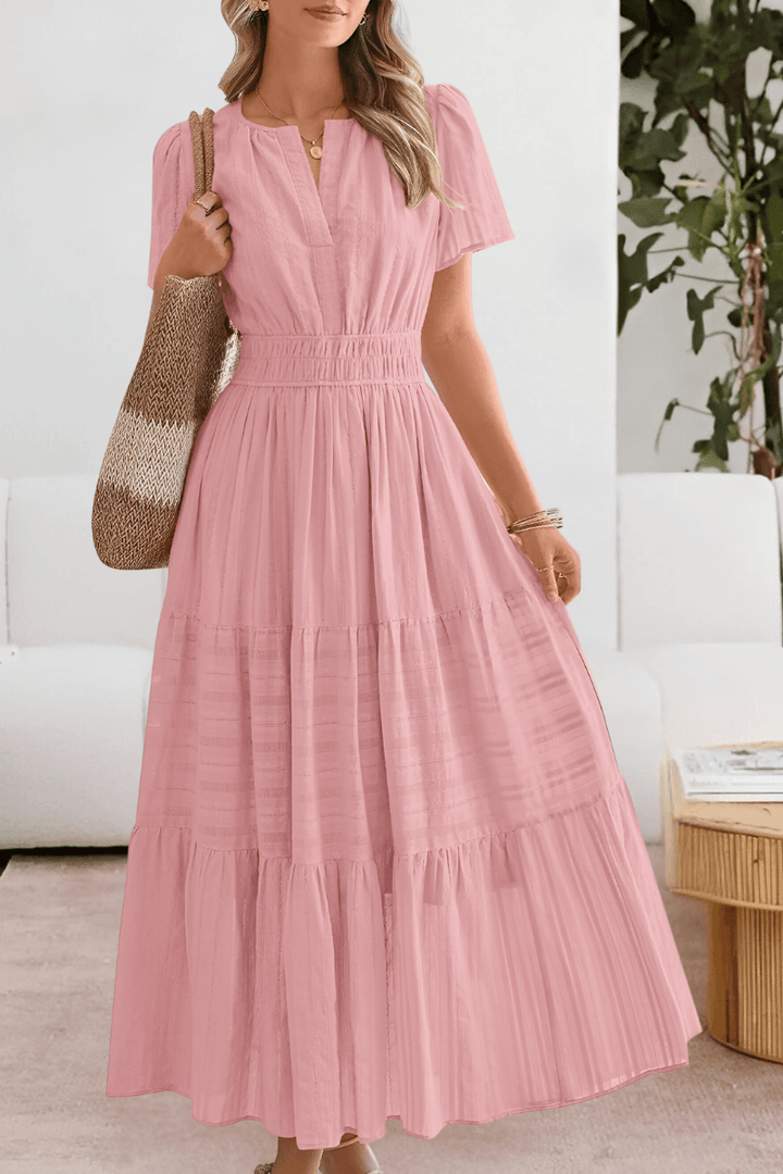 Flutter-sleeve maxi dress showcasing tiered skirt design