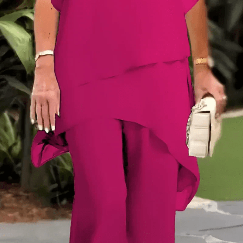 Sophisticated wedding guest outfit showcasing the graceful draped silhouette of the set
