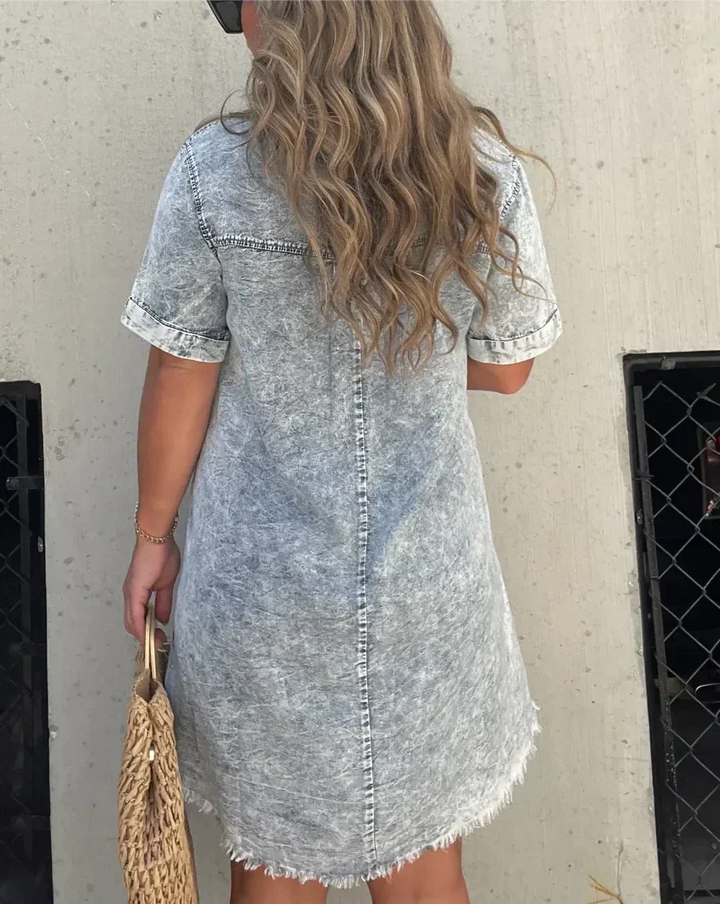 Back view of a woman wearing a casual denim shirt dress