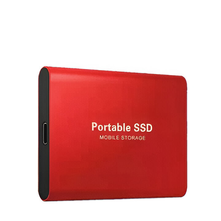 High-speed solid state drive resting next to a laptop for fast computer backup