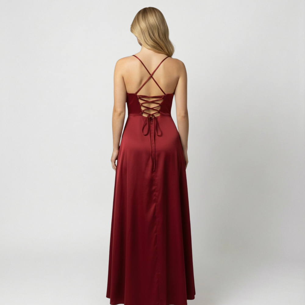 Back view of the red satin maxi dress showcasing the lace-up strap details