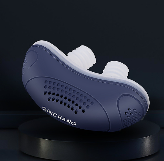 Close up of the anti snoring micro CPAP device in dark blue