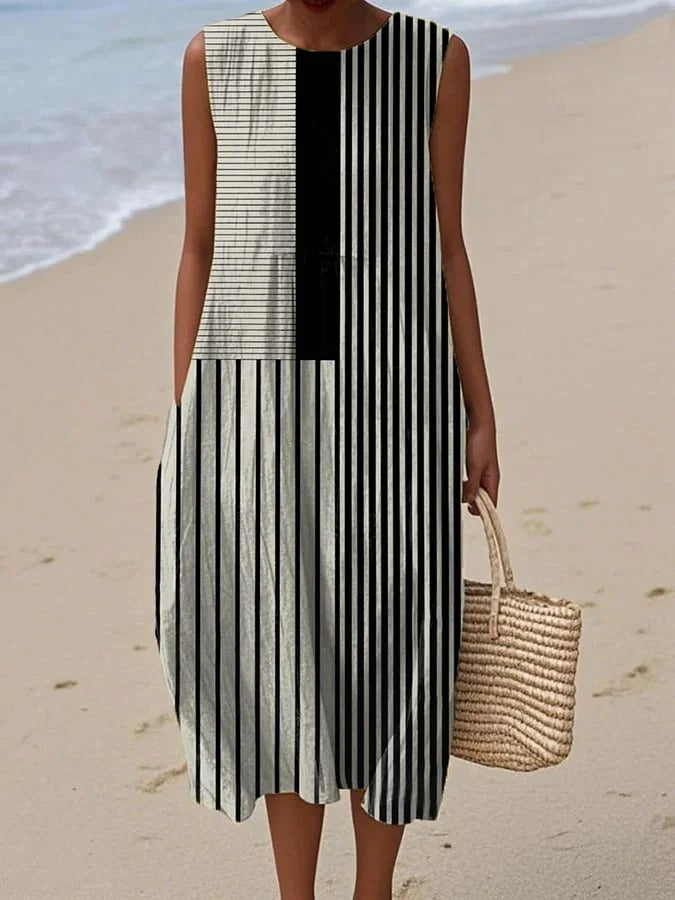 Women wearing a sleeveless striped summer dress on the beach