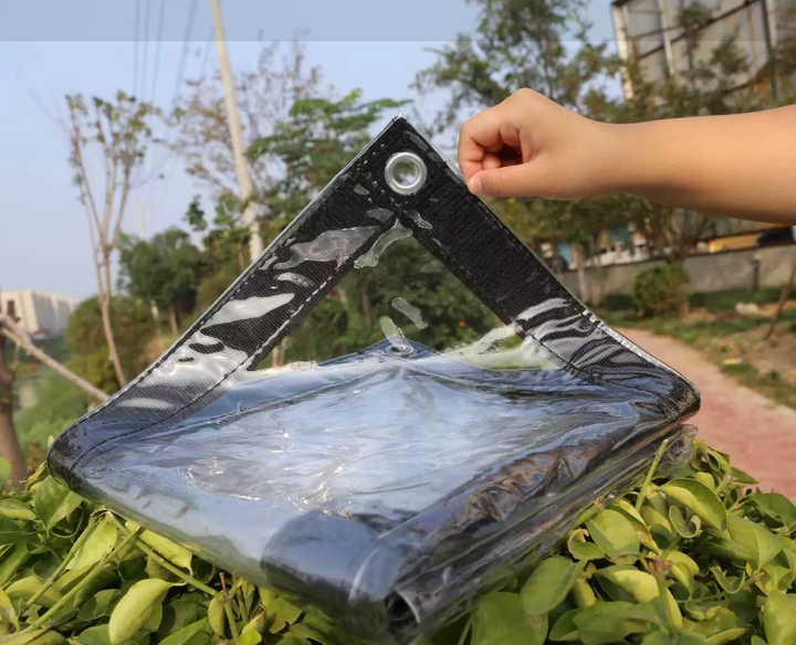 Clear garden shelter tarp blocking wind and rain on a balcony enclosure