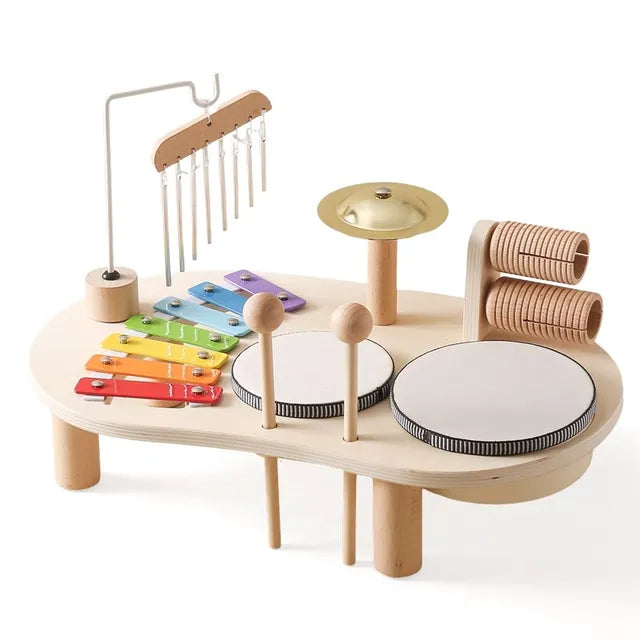 Wooden musical instrument station for children featuring a xylophone and drums