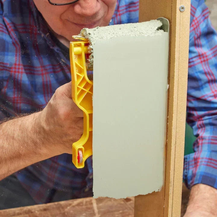 Close-up of the paint roller edge mechanism for precise cutting in