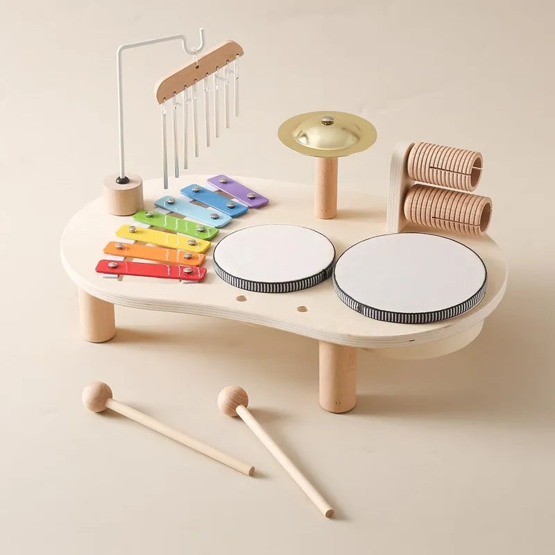 Close-up view of the xylophone and mallet on the wooden musical toy station