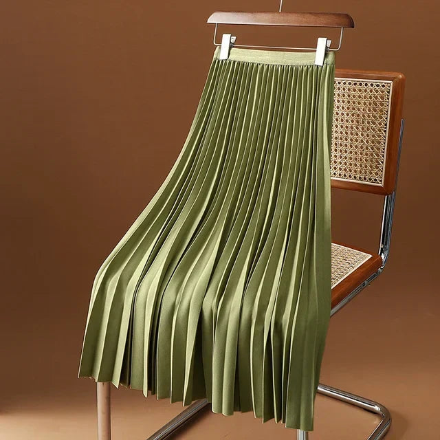 Fabric drape and movement of a women's elegant pleated midi skirt