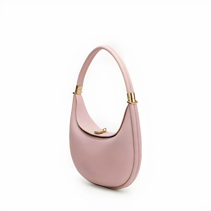 Detailed view of the hardware and zipper closure on a stylish crescent handbag.