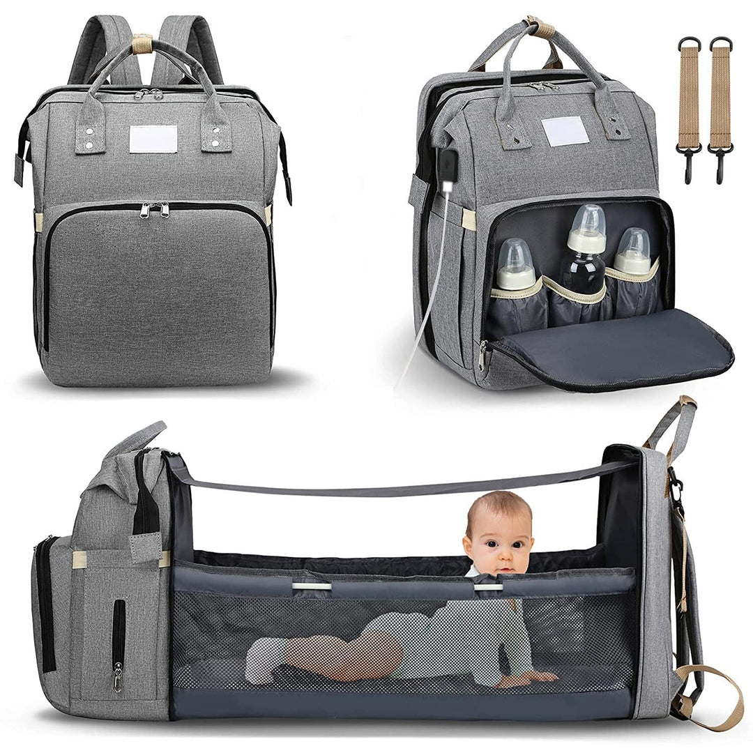 Grey multi-function baby diaper backpack shown with folded changing bed feature