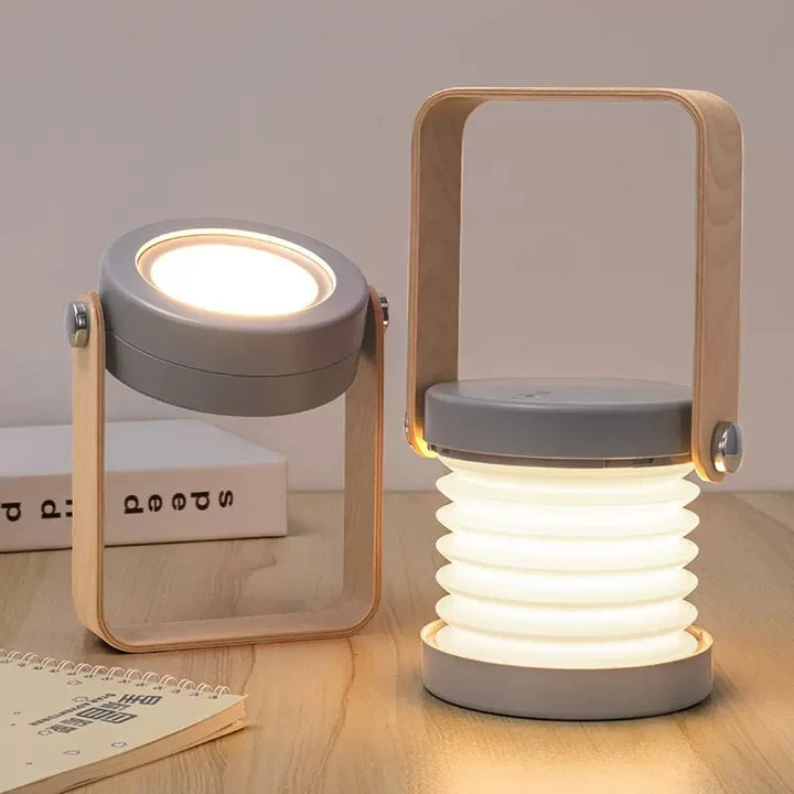 Grey wireless rechargeable table lamp shown in multiple configurations next to a book