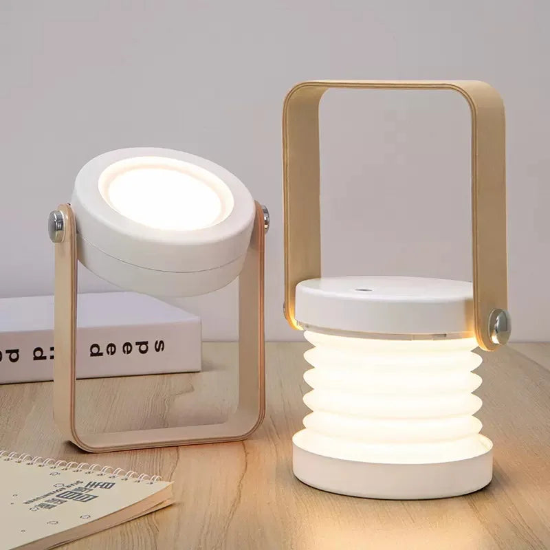 White wireless rechargeable table lamp displayed on a wooden surface with books