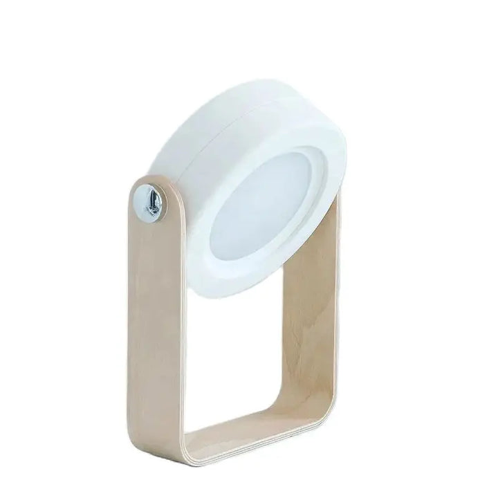 Rechargeable grey bedside light illuminating a cozy bedroom decor setting