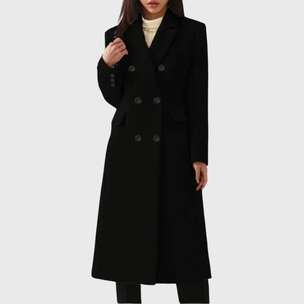 Model wearing a black double-breasted long tailored coat with flap pockets