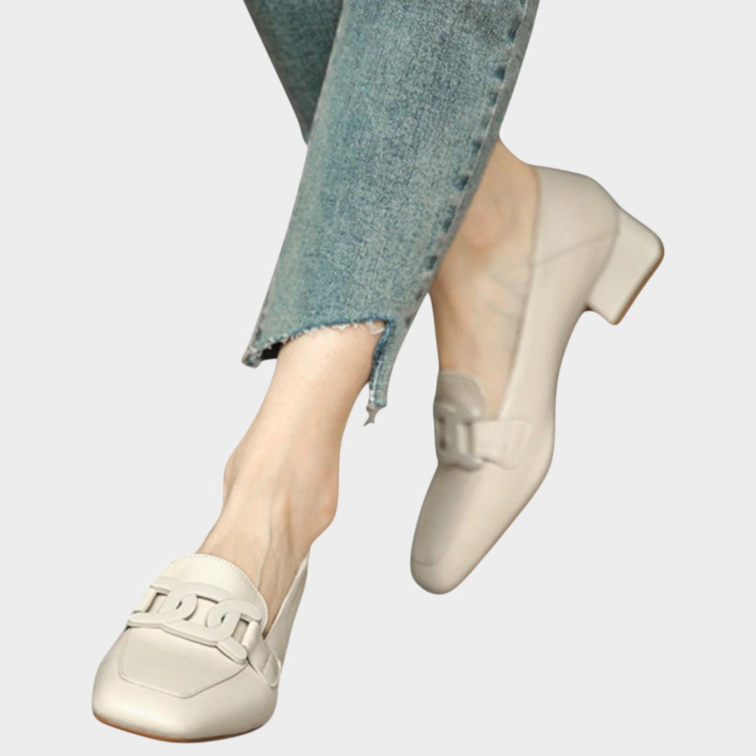 Side profile of women's orthopedic heeled loafers showing arch support