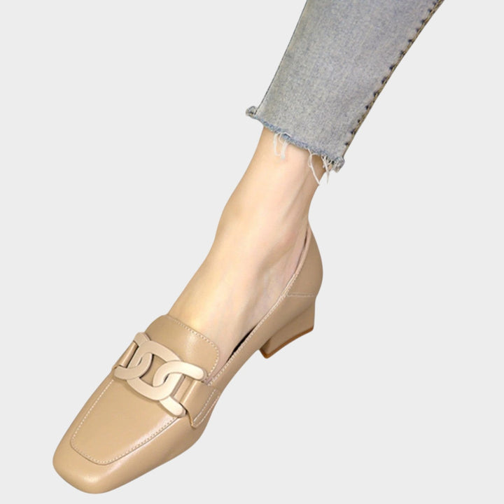 Back view of heeled loafers for women displaying cushioned heel design