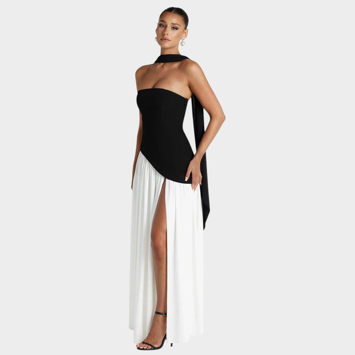 Model wearing black and white two-tone strapless evening gown
