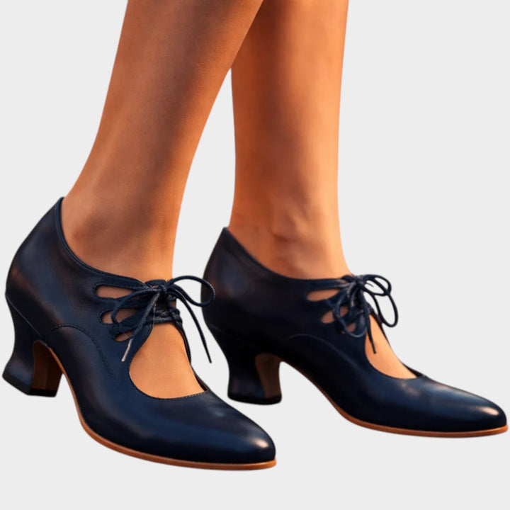 Side angle view of women's blue lace-up mid-heel shoes