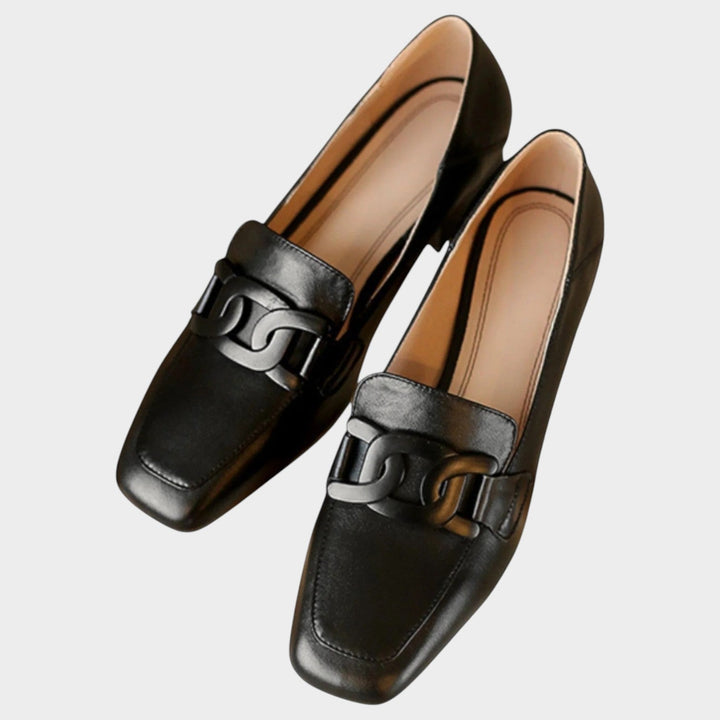 Pair of chic heeled loafers styled for professional and casual outfits