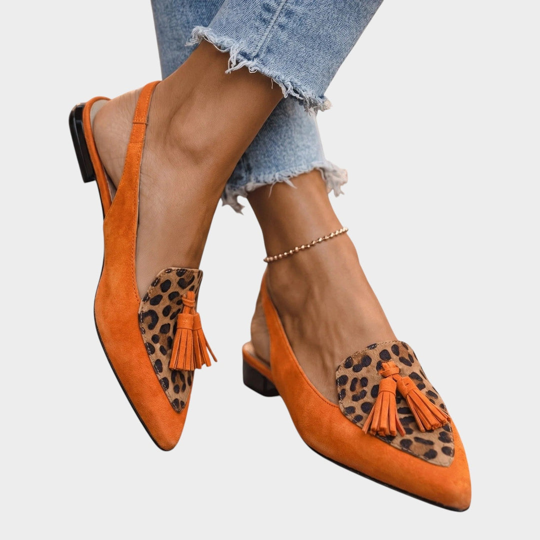 Women wearing orange and leopard strappy tassel flat sandals