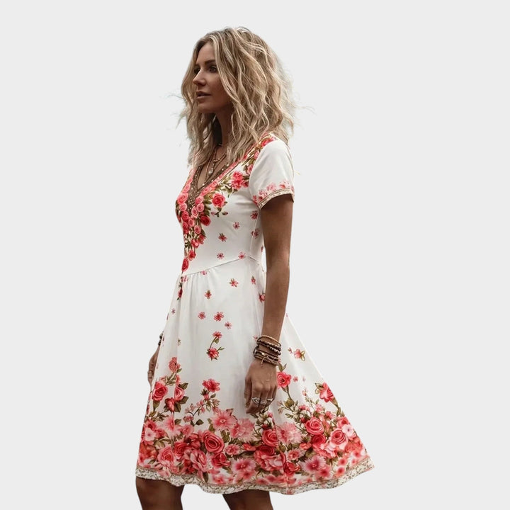 Side profile view of a woman in a floral midi dress showcasing the A-line silhouette