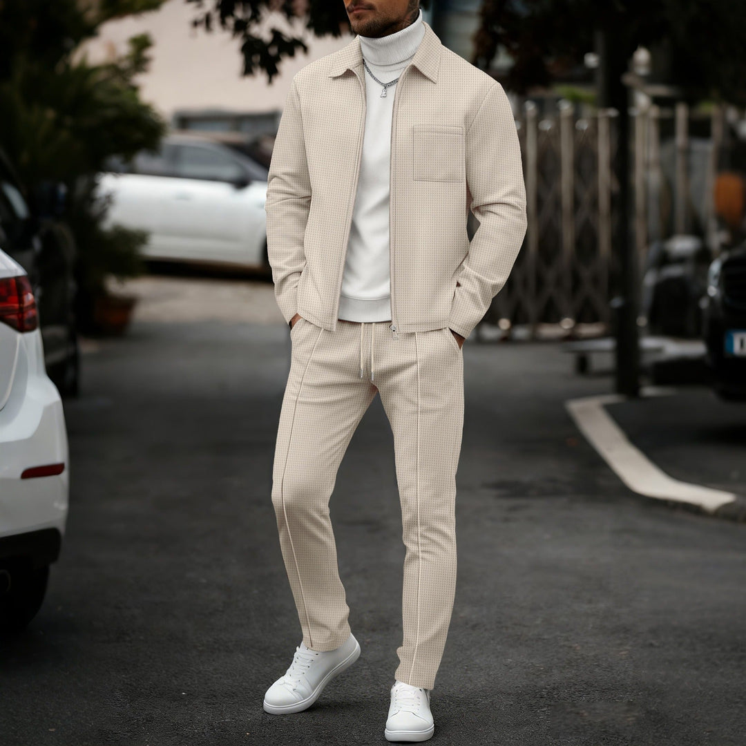 Man wearing a beige slim fit zip set outdoors