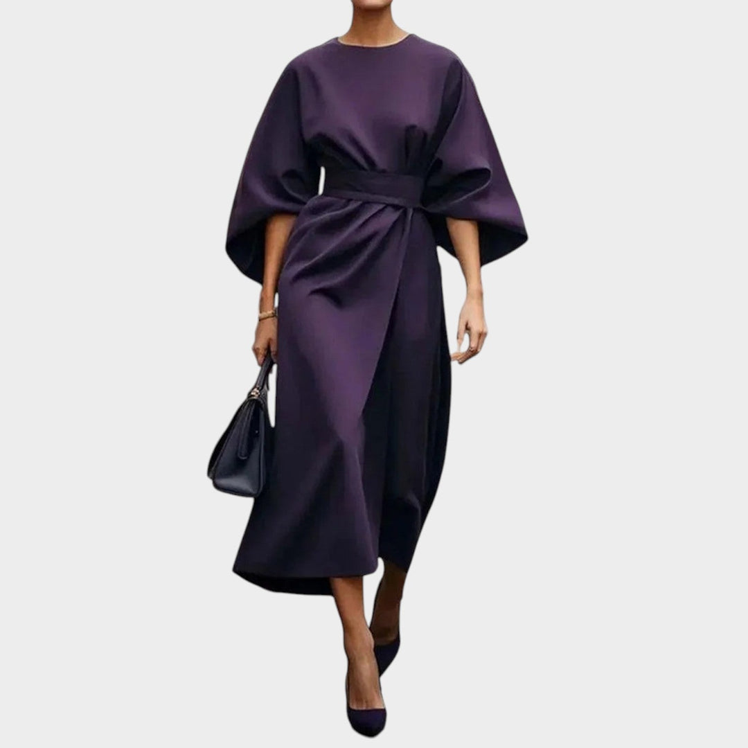 Woman wearing purple kimono sleeve maxi dress with flowing length