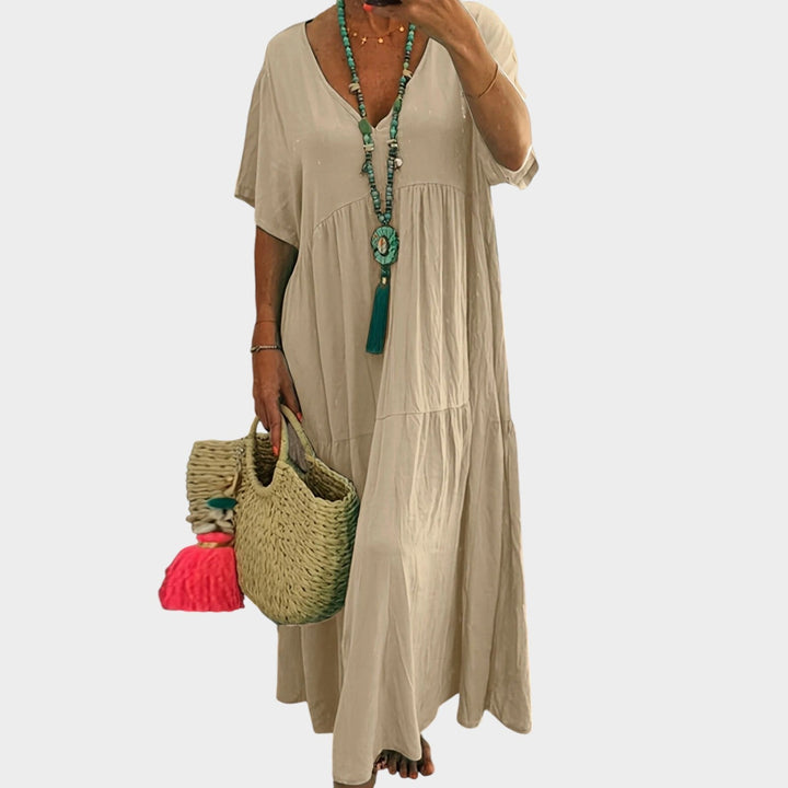 Plus size V-neck maxi dress back view showcasing casual A-line tiered skirt design