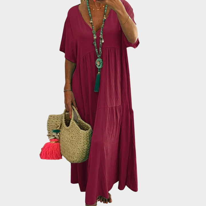 Full length view of plus size tiered maxi dress in motion