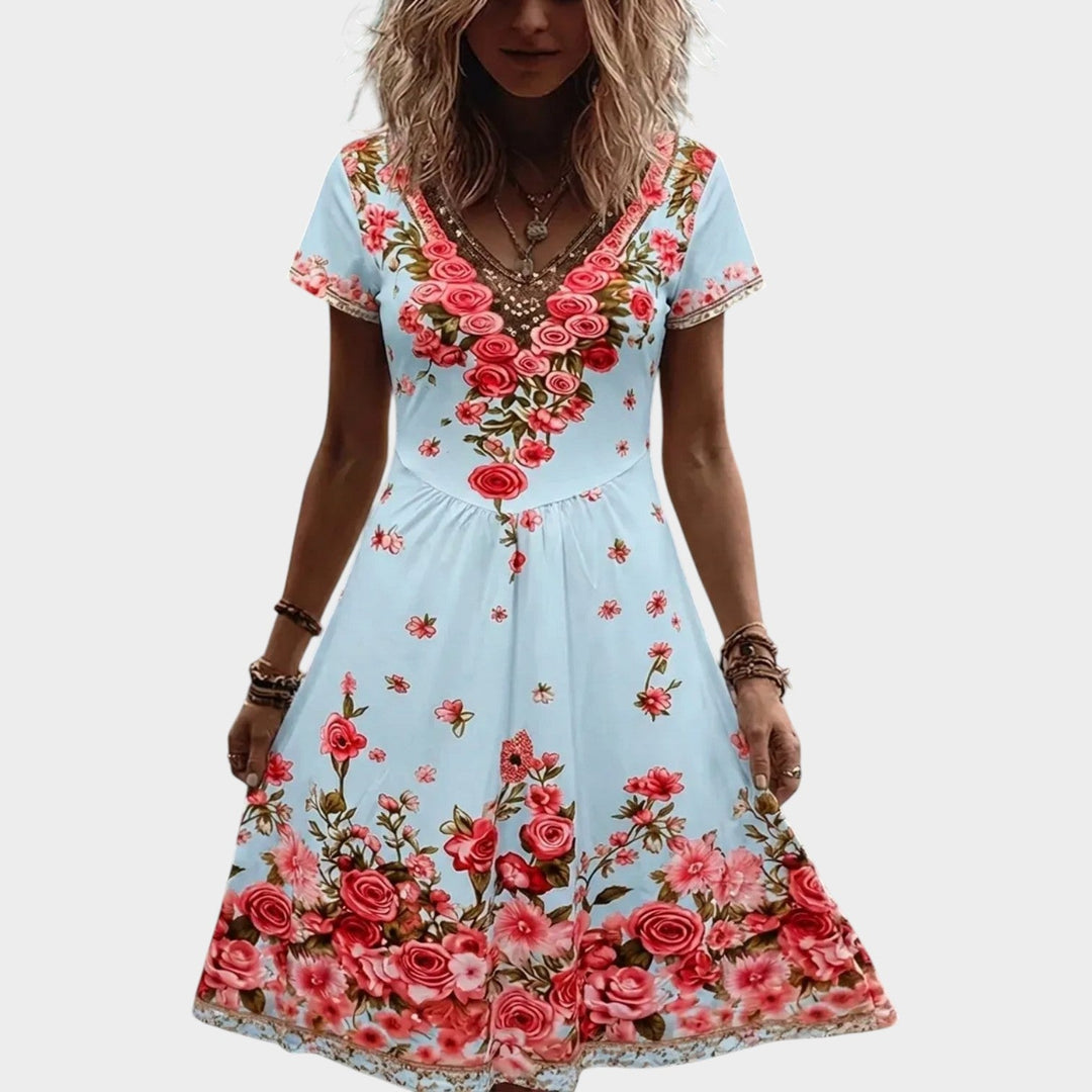 Floral v-neck midi dress featuring short sleeves and a summer A-line design