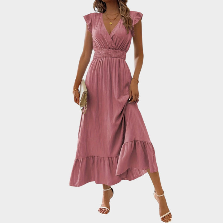 Detailed shot of V-neckline and fabric texture on maxi dress