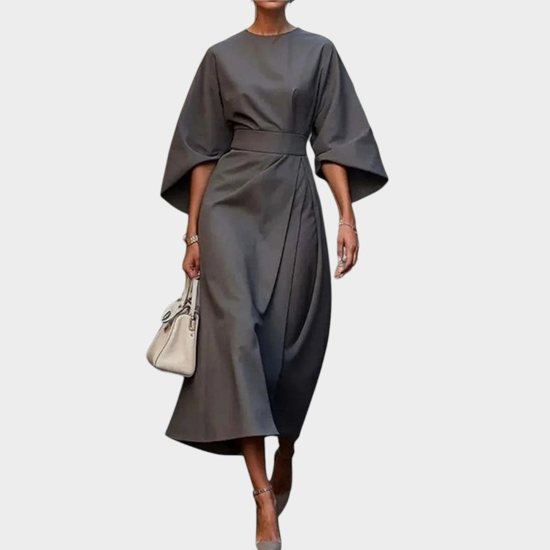 Close-up of flowing kimono sleeve on a stylish long evening maxi dress
