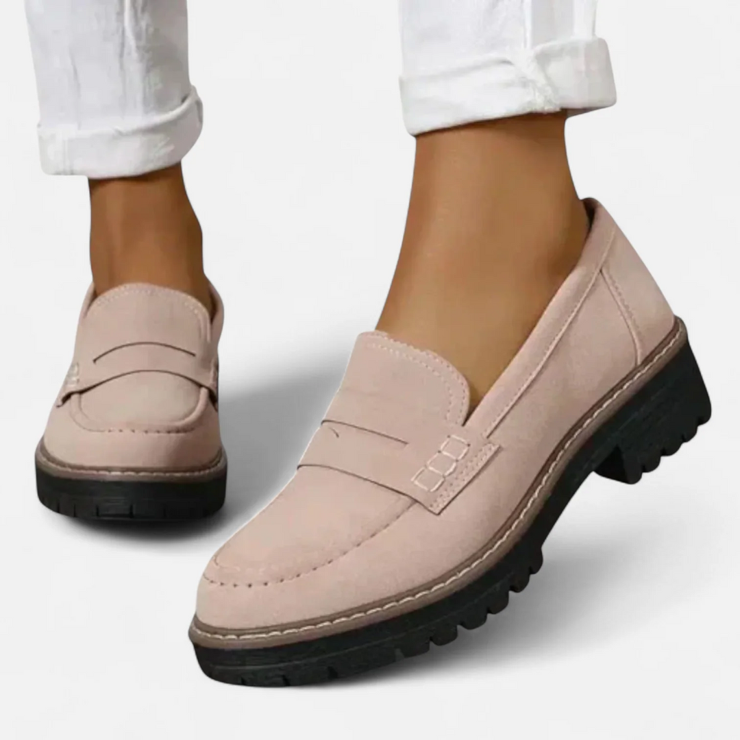 Pink comfort walking loafers paired with white trousers