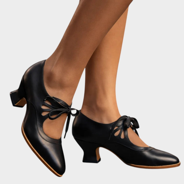 Close-up texture shot of premium material on classic mid-heel shoes