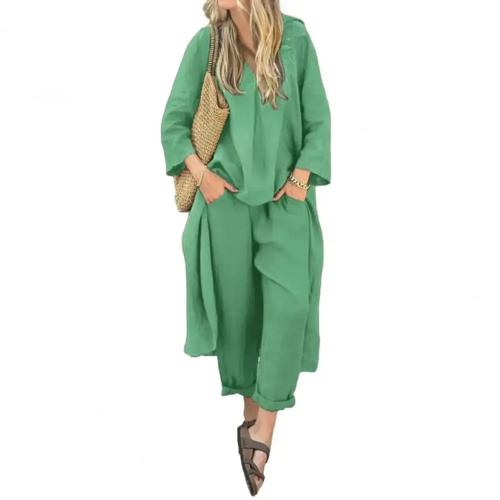 Back view of the women's relaxed long vest and wide-leg pants ensemble