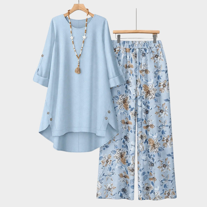 Full view of casual womens floral trousers and button top two-piece set