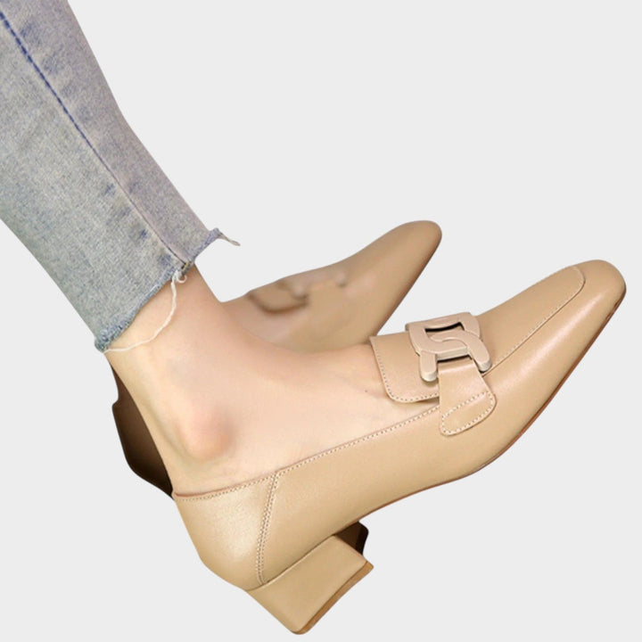 Model wearing comfortable orthopedic heeled loafers with daily wear