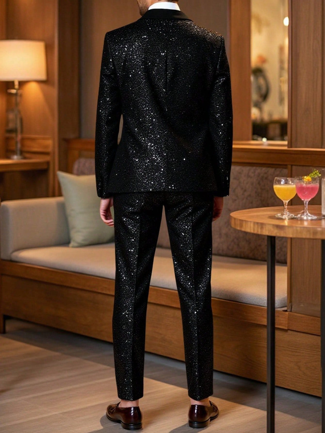 Back view of man wearing black glitter suit set