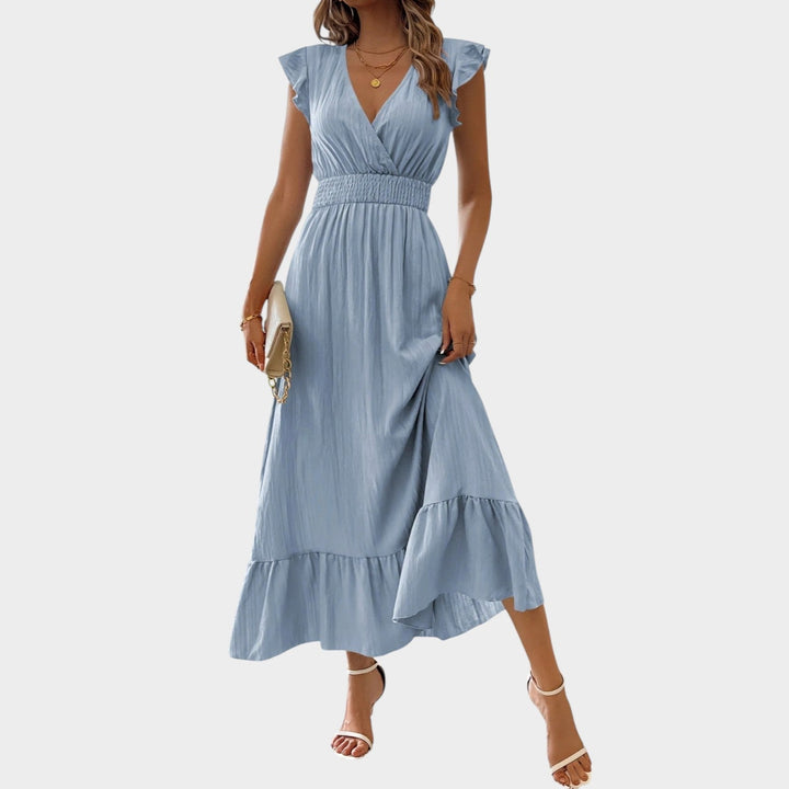 Woman wearing sky blue V-neck ruffle sleeve maxi dress