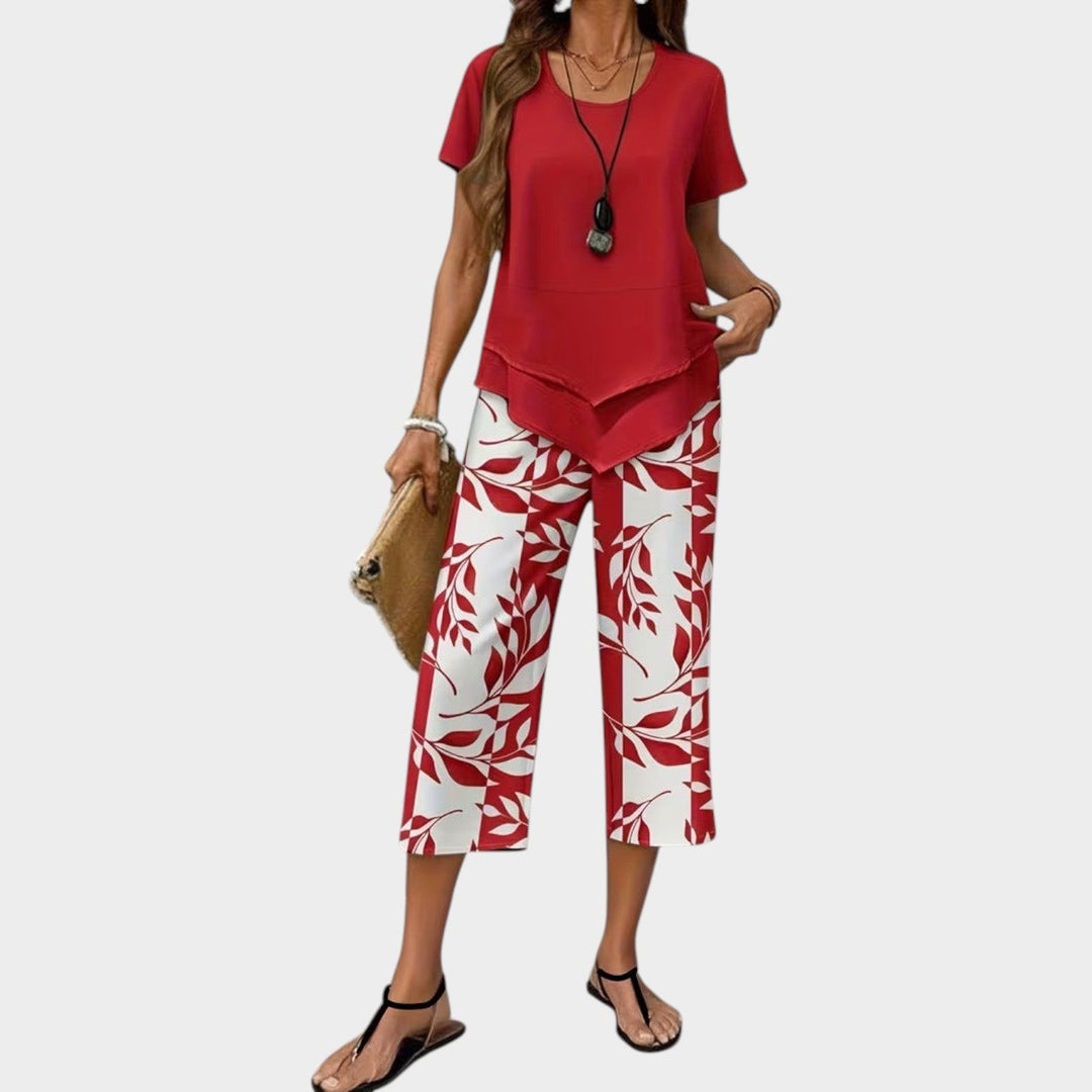 Woman showcasing the red casual printed two-piece matching set with short sleeves