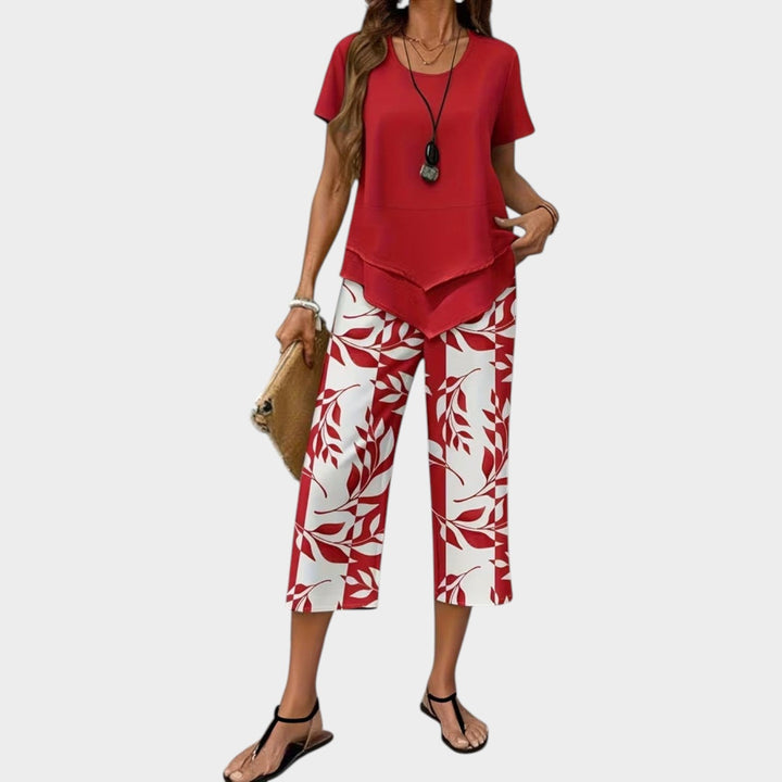 Woman showcasing the red casual printed two-piece matching set with short sleeves