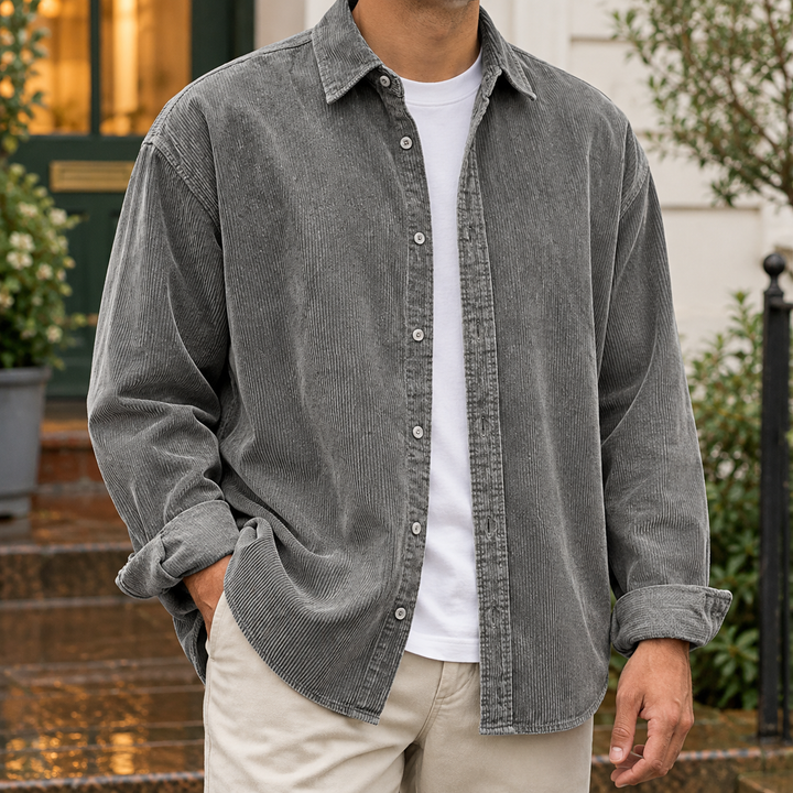 Man wearing gray textured overshirt outdoors with a white t-shirt